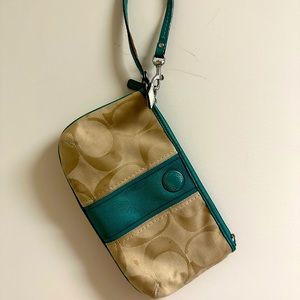 Tan Coach wristlet.